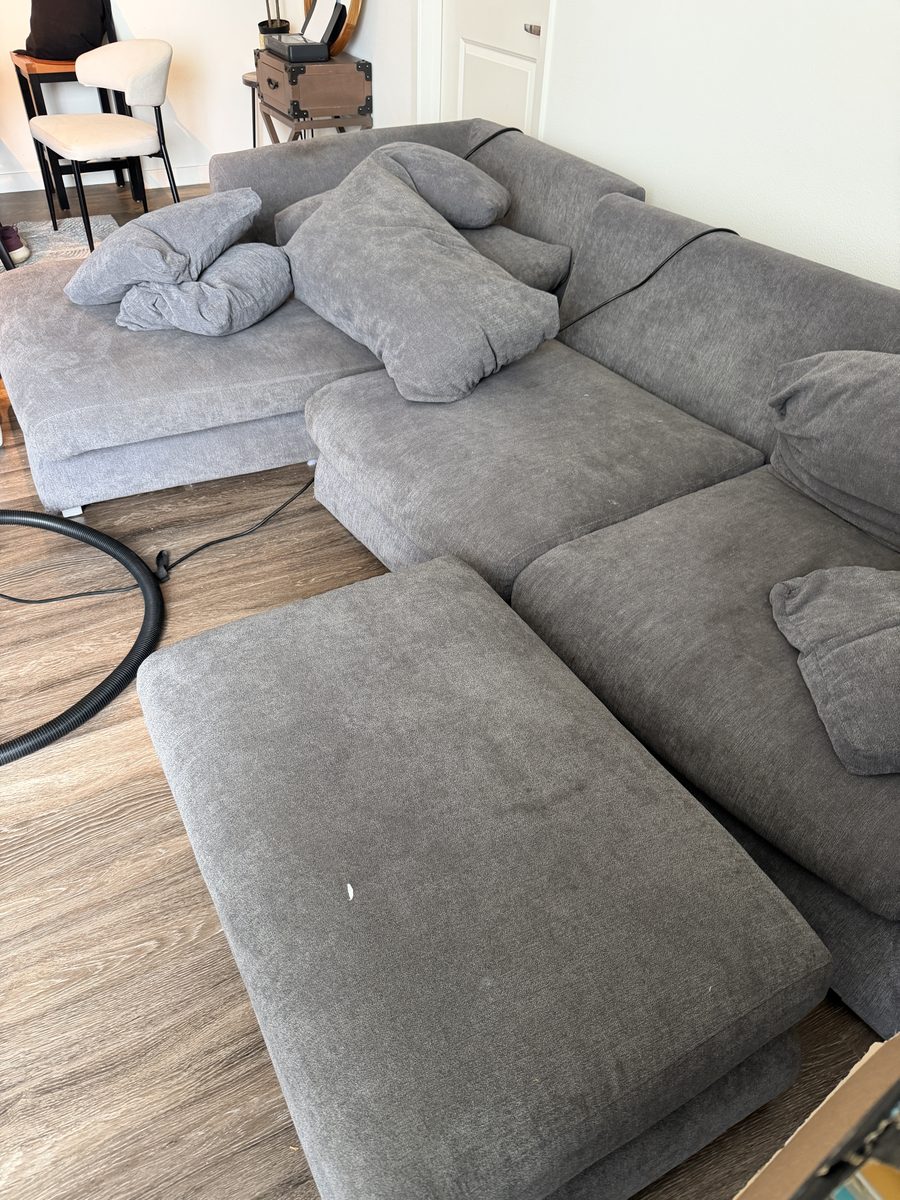 Before: grey family sectional with everyday soil and body oils