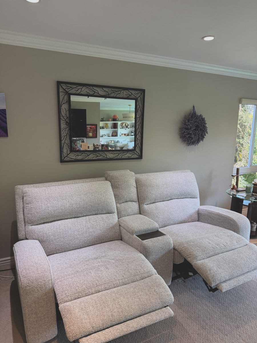 Before: cream reclining loveseat with soiled headrests and arms