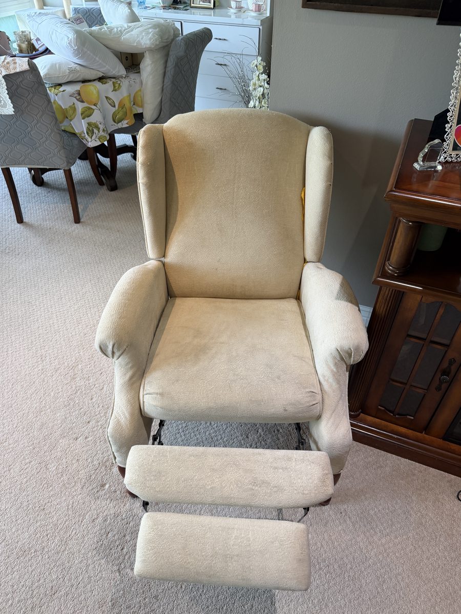 Before: cream wingback recliner with soiled arms and seat