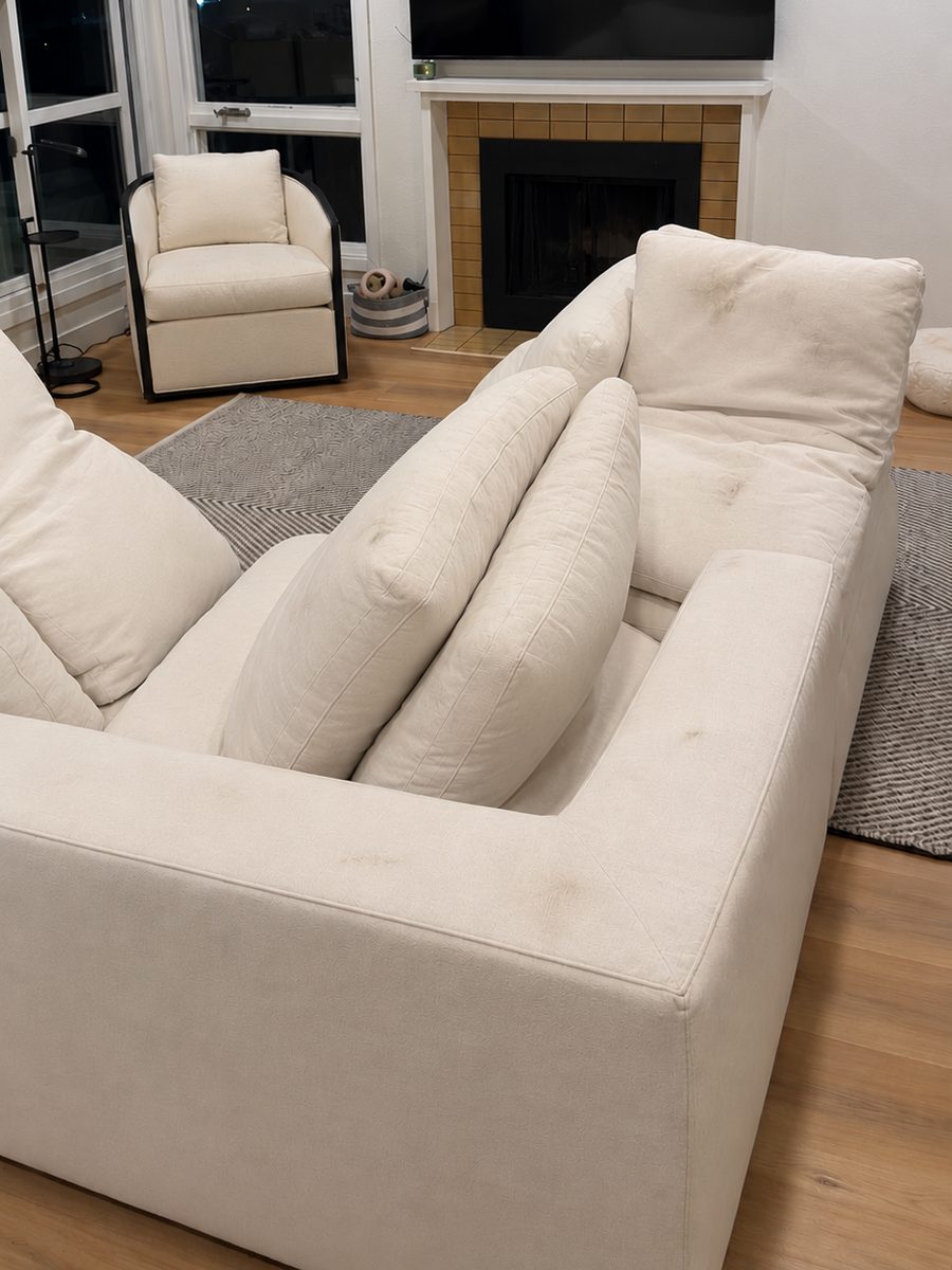Before: white modular sofa with stains on the arm and back cushions